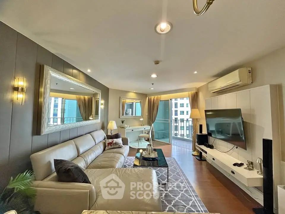 Luxurious living room with modern decor and spacious balcony view
