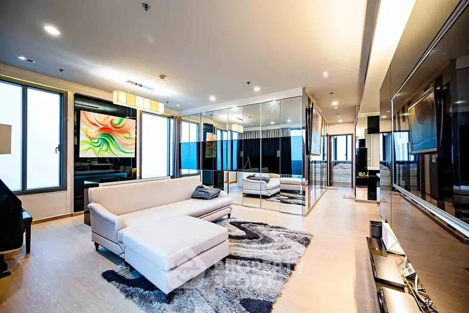 Luxurious modern living room with mirrored walls and elegant decor