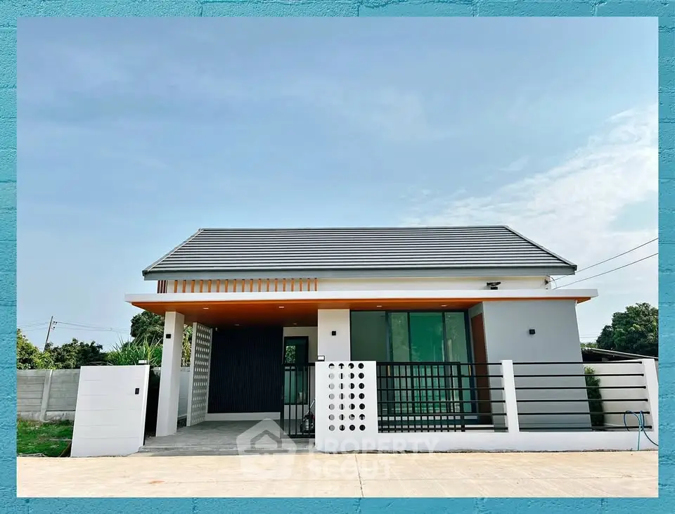 Modern single-story house with sleek design and spacious driveway, perfect for contemporary living.