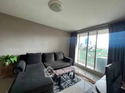 Spacious living room with modern sofa and balcony view