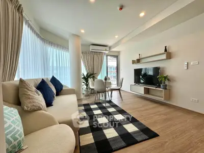 Spacious modern living room with stylish decor and natural light