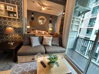 Modern living room with stylish decor and balcony view in urban apartment