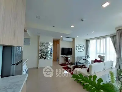 Modern living room with stylish decor and large windows offering natural light.