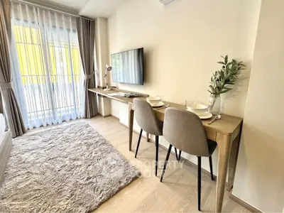 Modern living room with cozy dining area and natural light