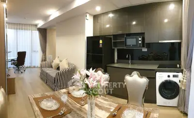 Luxurious open-plan living room with modern kitchen and elegant dining area