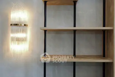 Modern interior with elegant wall light and minimalist shelving unit