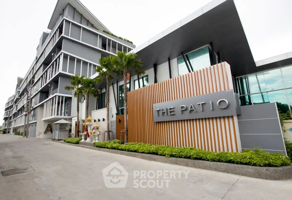 Modern building exterior with sleek design and lush landscaping