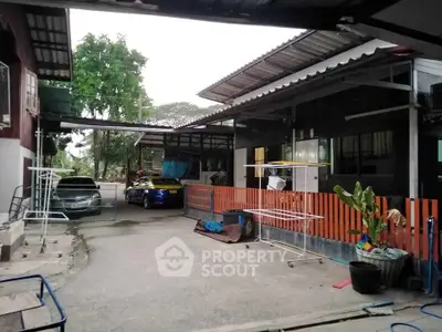 Charming residential property with spacious outdoor area and ample parking space.