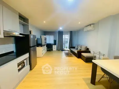 Spacious modern living room with open kitchen and stylish decor