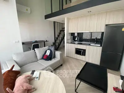 Modern loft apartment with sleek kitchen and cozy living area