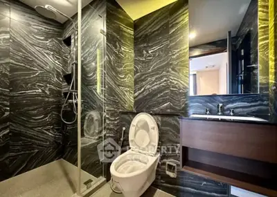 Luxurious modern bathroom with elegant marble walls and sleek fixtures