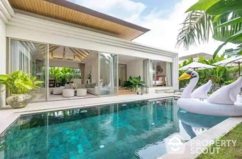 Luxurious villa with private pool and modern open living area, perfect for tropical retreats.