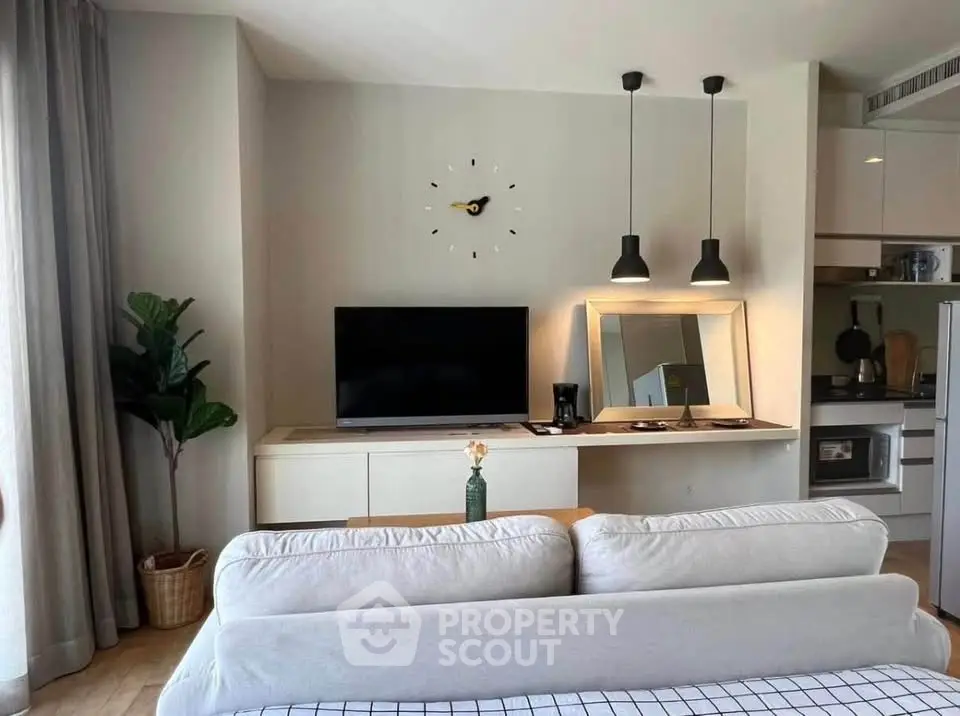 Modern living room with stylish decor and open kitchen layout