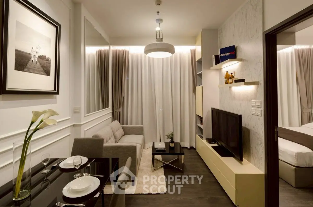 Modern living room with elegant decor and cozy dining area in a stylish apartment.
