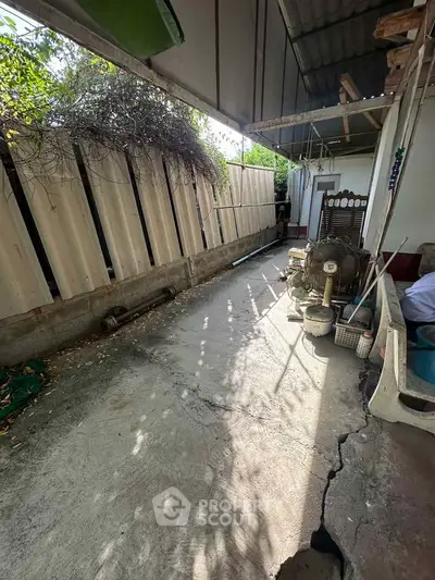 Spacious outdoor area with potential for renovation and landscaping.