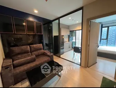 Modern apartment interior with cozy living room, sleek kitchen, and bright bedroom, featuring stylish furniture and decor.