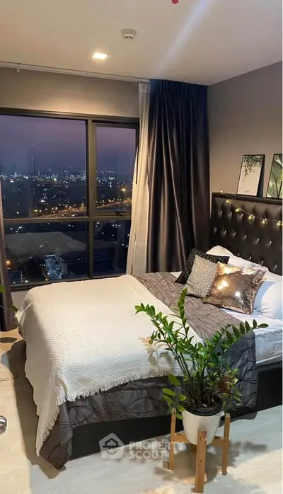 Luxurious bedroom with stunning city view and elegant decor