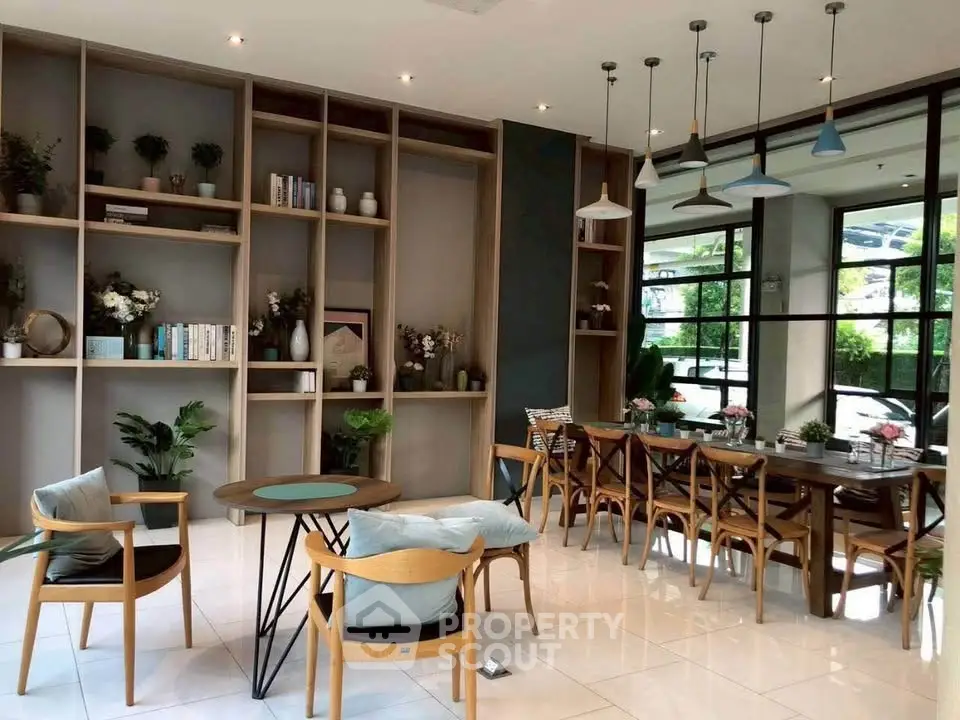 Stylish modern living room with elegant dining area and large windows offering lush garden views.