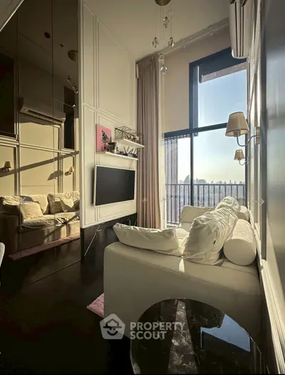 Luxurious living room with floor-to-ceiling windows and elegant decor