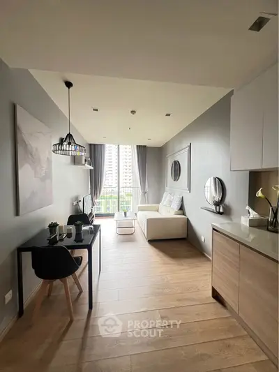 Modern open-plan living room with stylish decor and city view