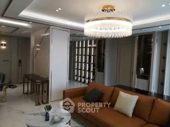 Luxurious living room with elegant chandelier and modern decor