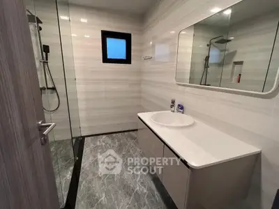 Modern bathroom with sleek design and spacious shower area