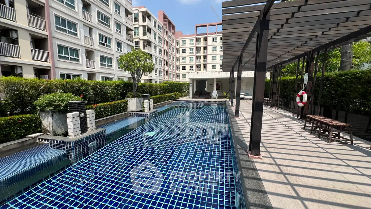 Luxurious condominium with stunning outdoor pool and modern amenities.