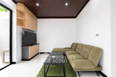 Modern living room with sleek furniture and natural light