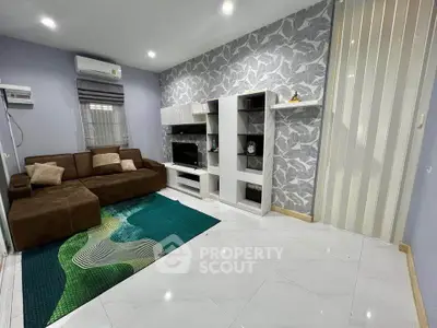 Modern living room with stylish wallpaper and cozy brown sofa