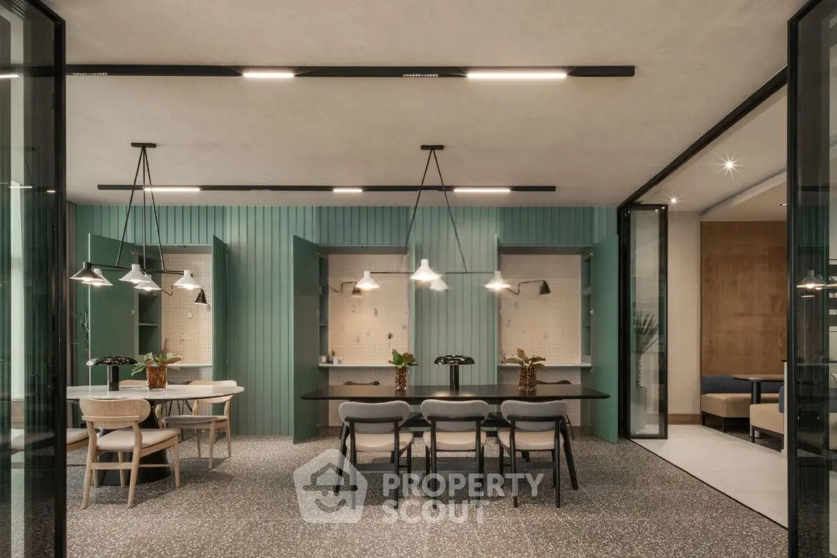 Modern dining area with stylish lighting and elegant decor in a contemporary home.