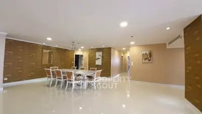 Spacious dining area with elegant chandelier and modern decor