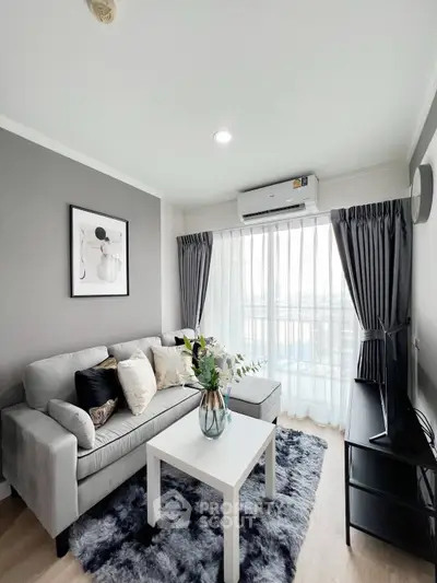 Modern living room with stylish decor and large window view