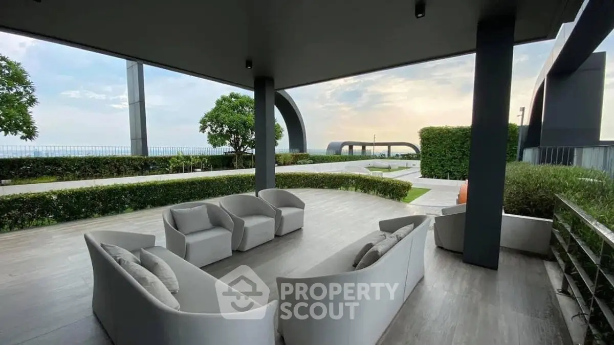 Luxurious outdoor seating area with ocean view and modern design.