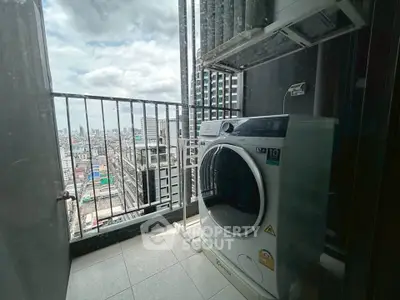 High-rise balcony with city view and modern washing machine, perfect for urban living.