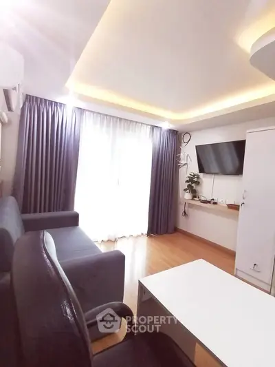 Modern living room with stylish lighting and sleek furniture