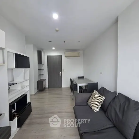Modern living room with sleek furniture and minimalist design in a stylish apartment.