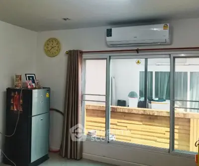 Modern living room with air conditioning and balcony view