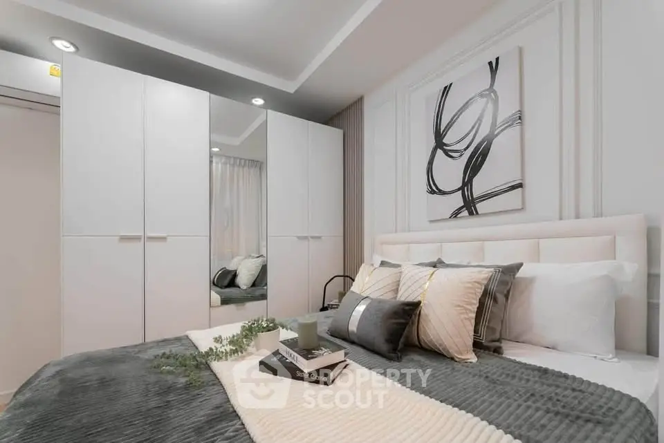 Modern bedroom with stylish decor and cozy bedding