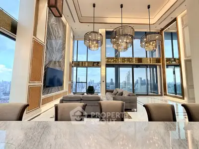 Luxurious high-rise living room with stunning city views and elegant chandeliers.