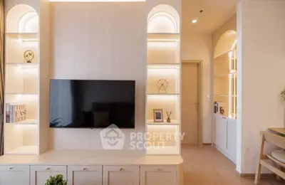 Modern living room with built-in shelves and wall-mounted TV