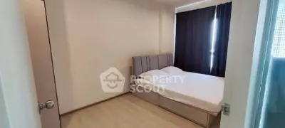 Cozy bedroom with modern bed and dark curtains, perfect for restful nights.