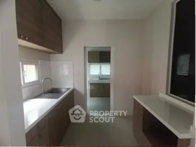 Modern kitchen with sleek cabinetry and ample counter space