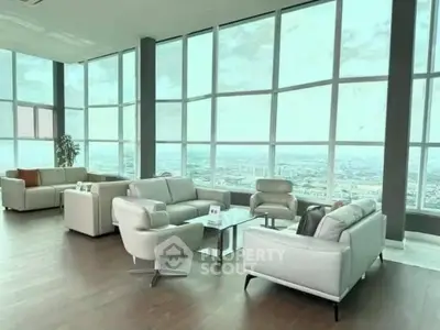 Luxurious living room with panoramic city views and modern furniture