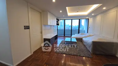 Spacious modern living room with city view and elegant wooden flooring