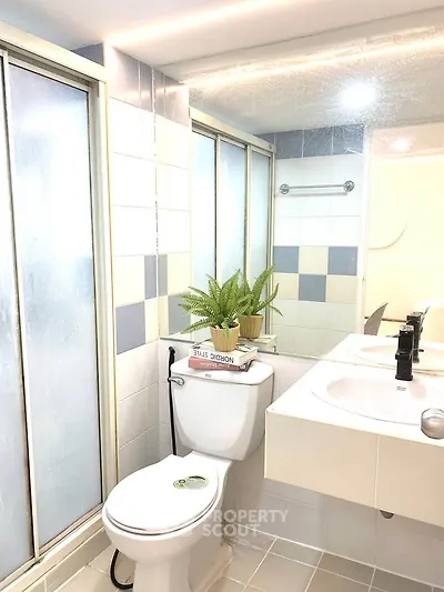Modern bathroom with sleek fixtures and stylish tile design