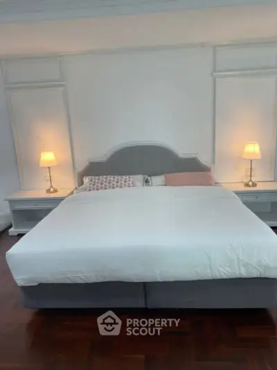 Spacious bedroom with elegant decor and cozy lighting, perfect for relaxation.