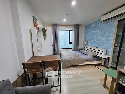 Modern studio apartment with stylish decor and city view