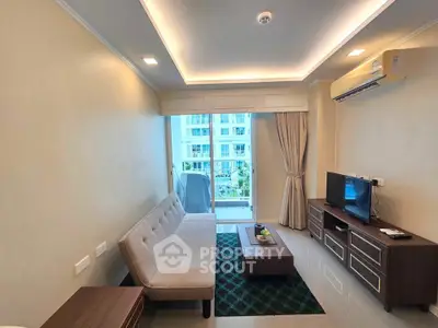 Modern living room with sleek furniture and large window offering natural light and city view.