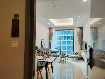 Modern living room with elegant decor and large window offering city view