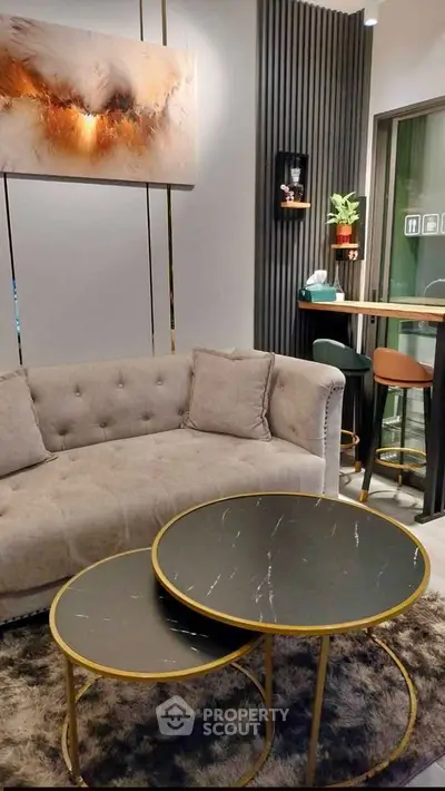 Stylish modern living room with plush sofa and chic round coffee tables